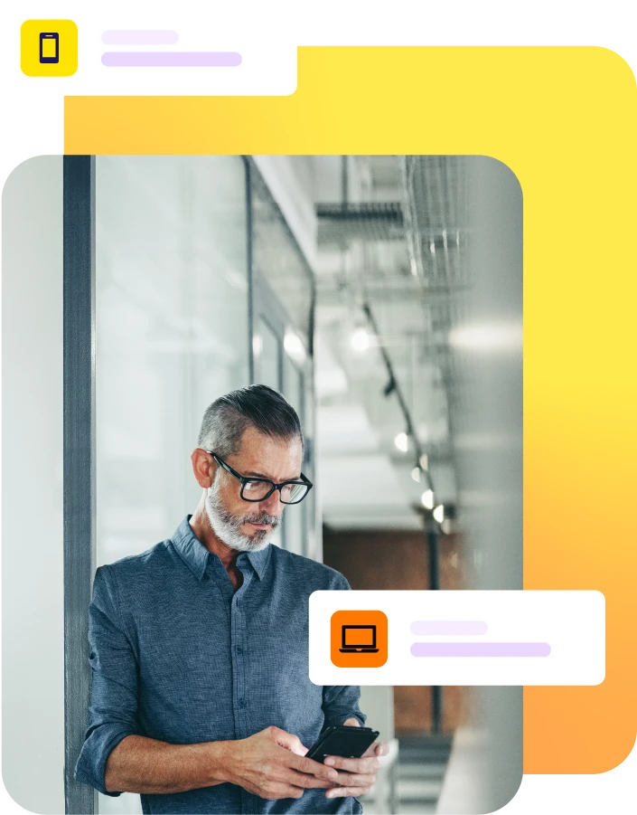 Man stood in hallway using mobile phone