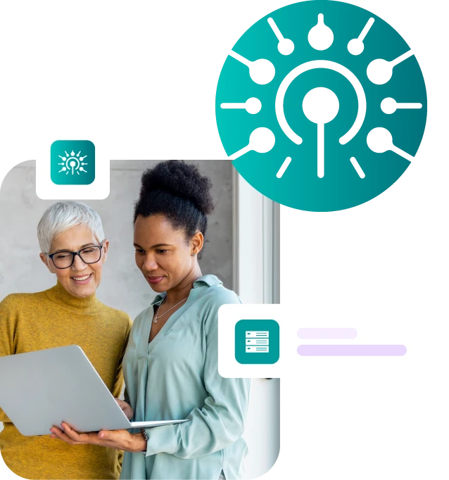 Two ladies looking at laptop