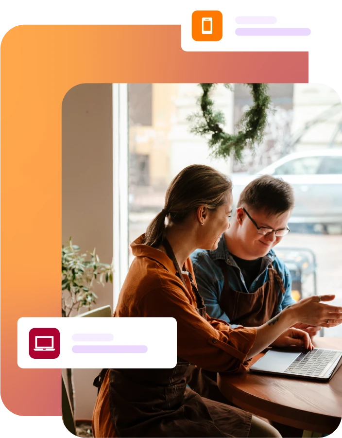 Two people using a laptop