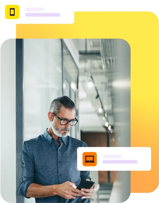Man stood in hallway using mobile phone